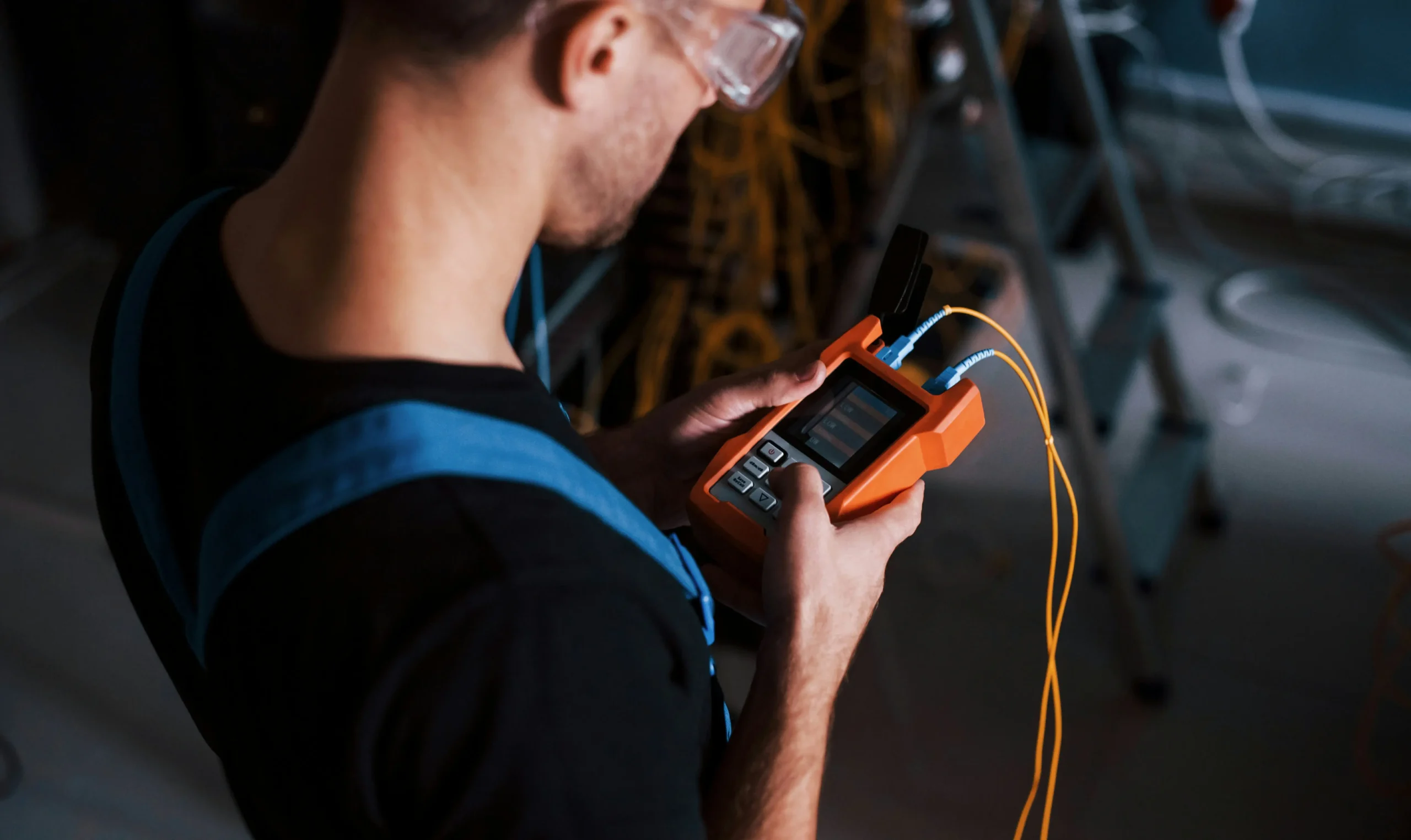 Technician checking readings on a handheld tester