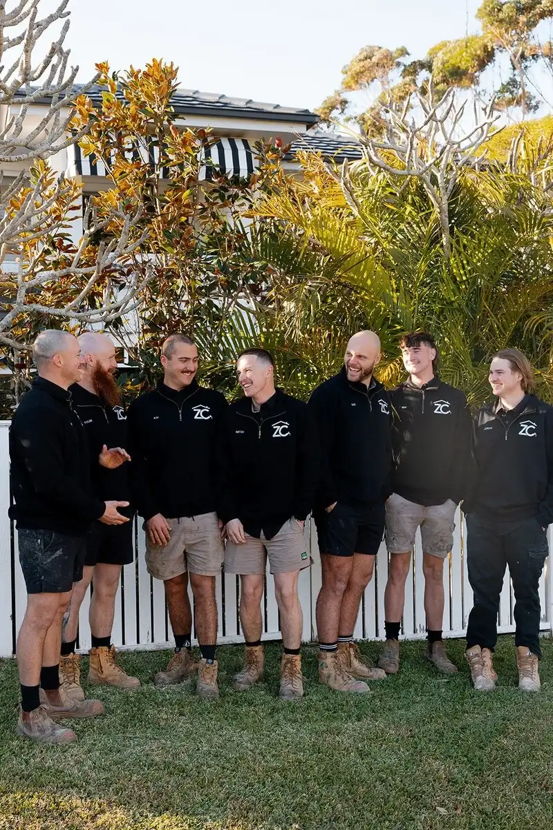 The seven-person ZC Plumbing & Bathroom Solutions team in their work uniforms
