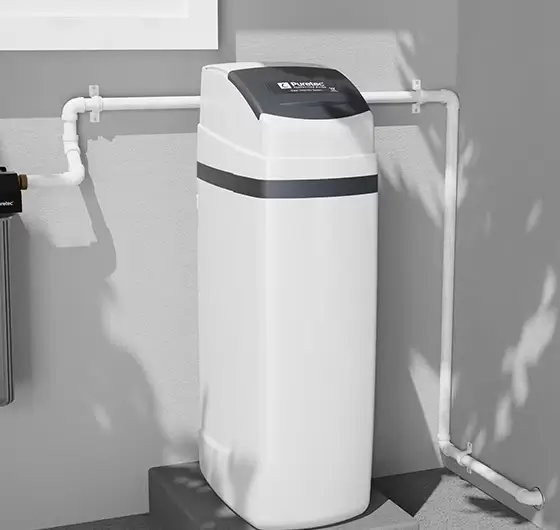Water softener connected to the mains water pipework